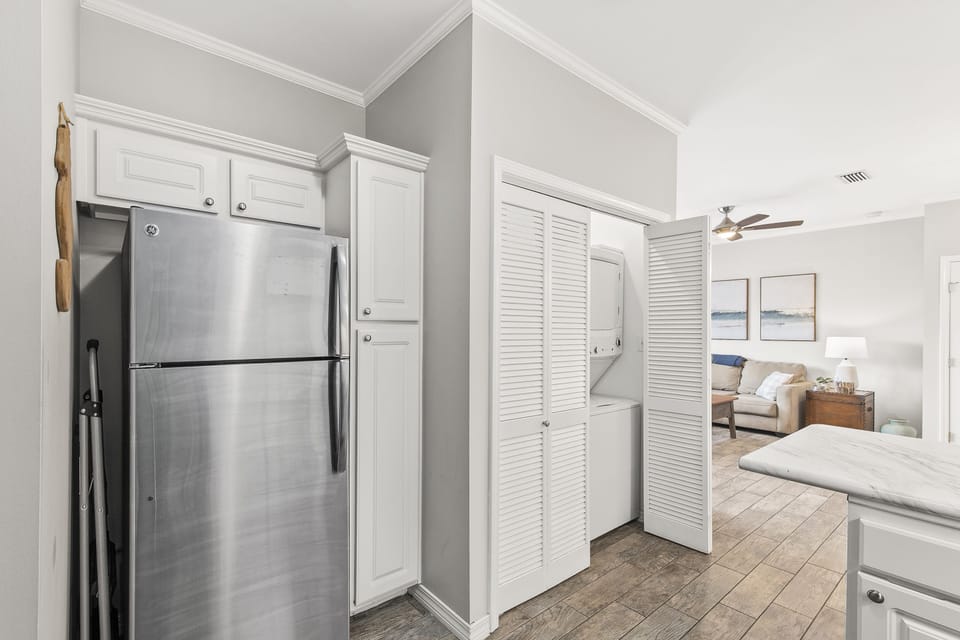 Washer and dryer located behind louvered doors for your convenience.