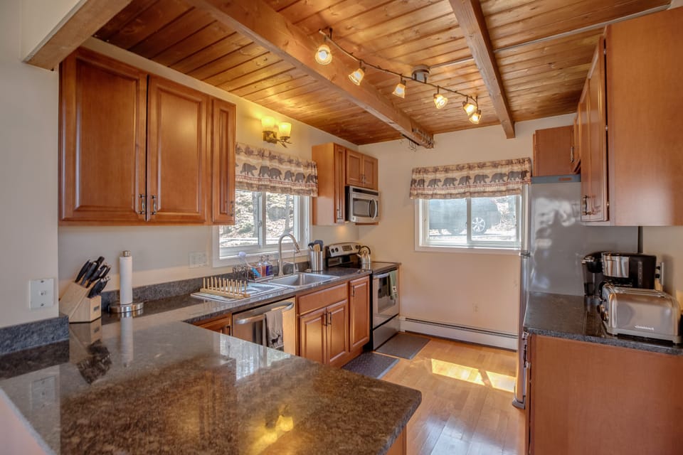 Kitchen with stove, oven, microwave, dishwasher, refrigerator