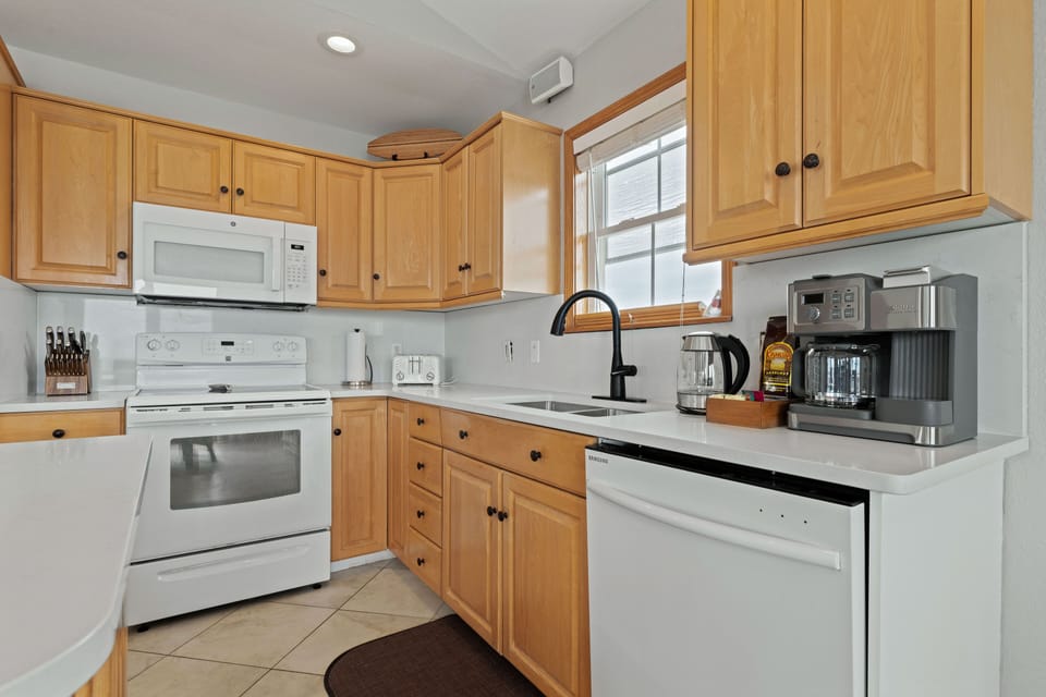 Kitchen - new quartz counters, sink and Island. Stainless steel appliances now