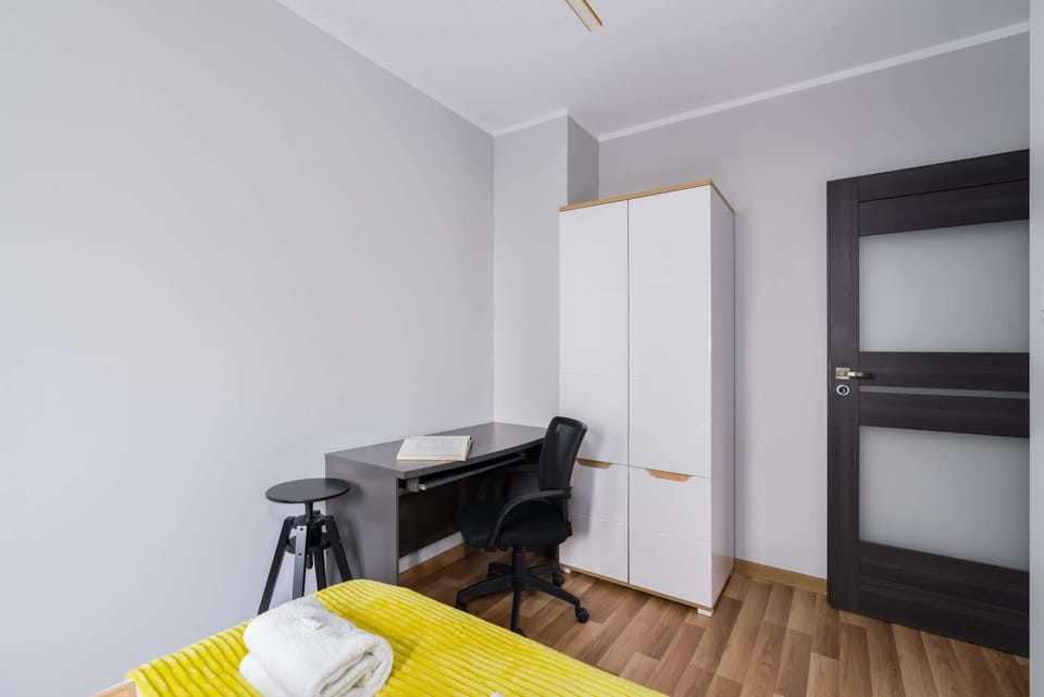 The bedroom's modern design ensures a comfortable stay. 