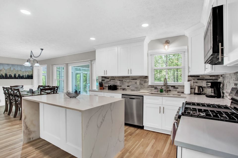 Open new kitchen with stainless steel appliances, kitchen island -MainLevel