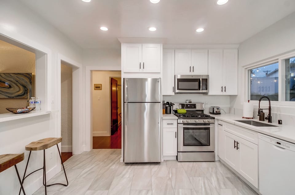 Discover culinary delights in the fully stocked kitchen of Seaview Oasis, equipped with modern conveniences for an unforgettable cooking experience.