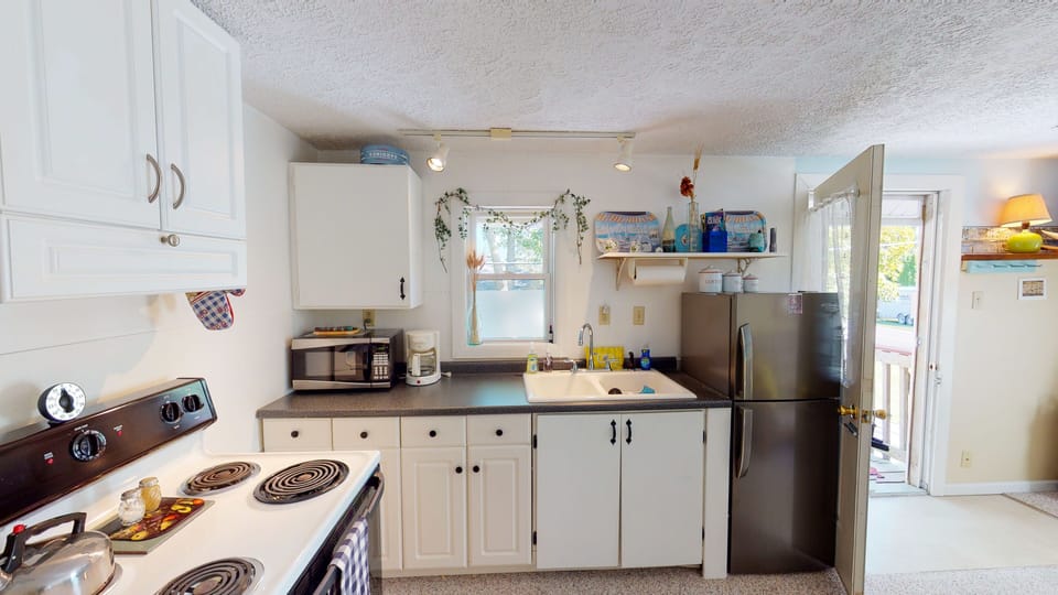 Efficient but well stocked kitchen allows you to make some meals at home.