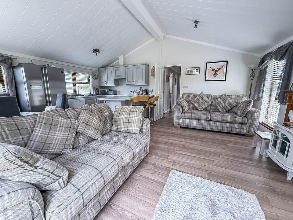 This expansive area seamlessly connects the kitchen, dining, and lounge areas, creating a wonderfully social and inviting atmosphere for everyone.