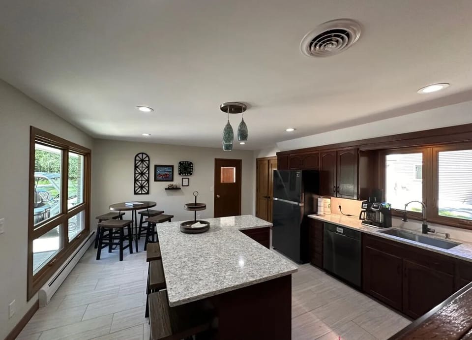 Kitchen, tall top table with 4 stools, plus 3 stools at island