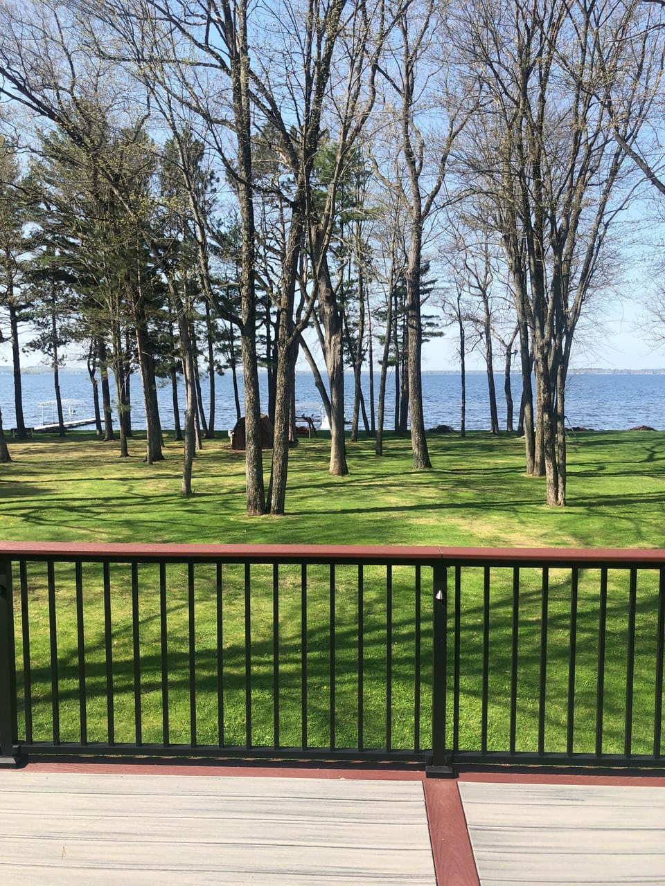 View from deck, over large private back yard and facing Shawano Lake