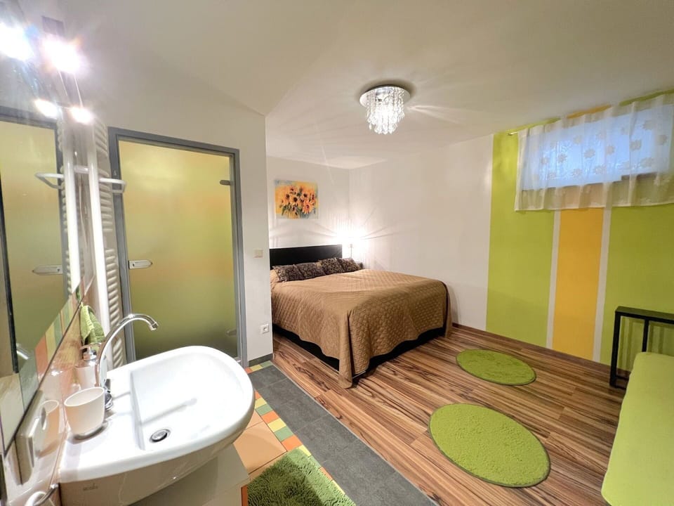 Furniture, Interior Design, Floor, Flooring, Wall, Bed, Room, Wood, Ceiling, Bedroom