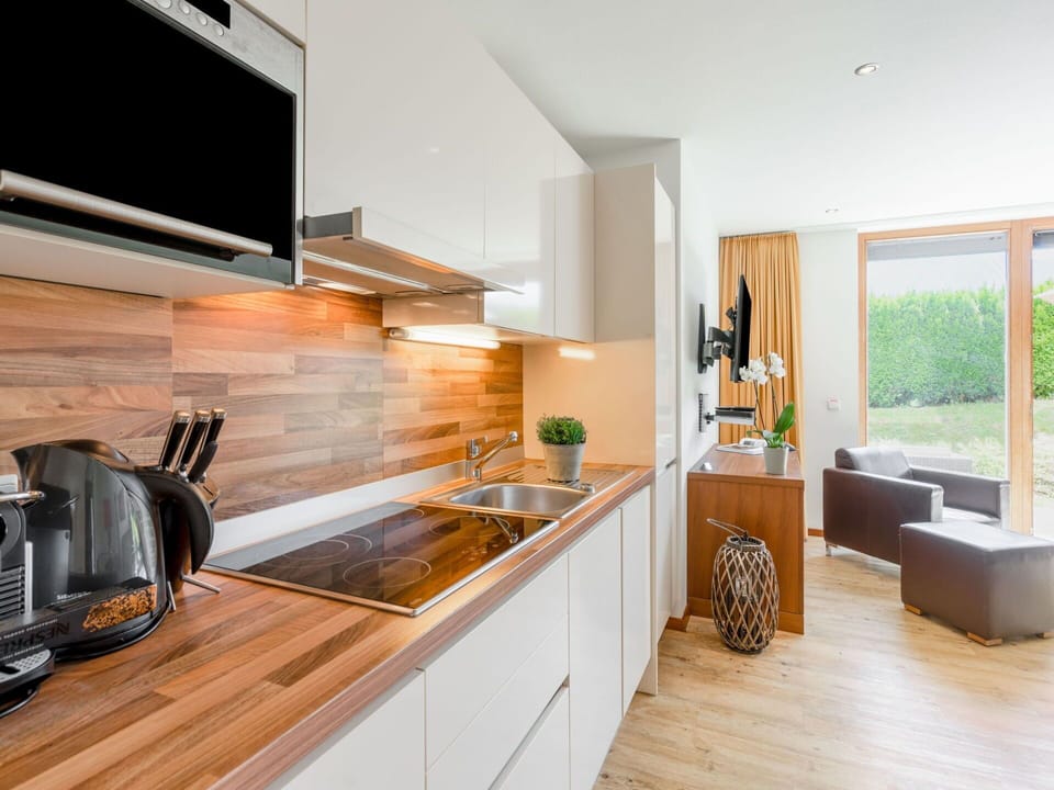 Cabinetry, Countertop, Furniture, Kitchen, Wood, Kitchen Appliance, Plant, Home Appliance, Flooring, Kitchen Stove