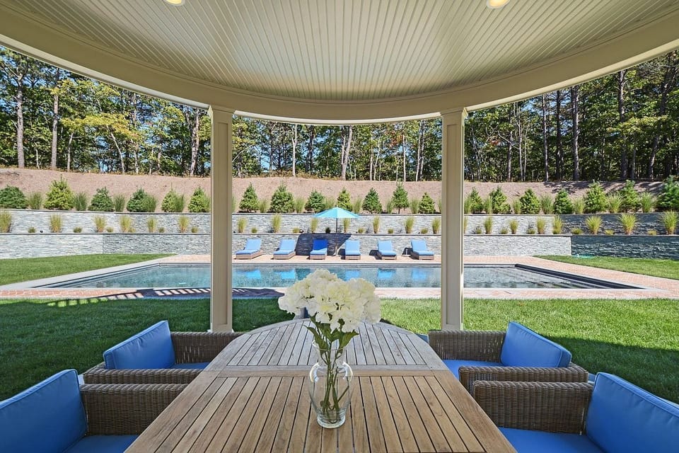view from living room towards pool, outdoor dining