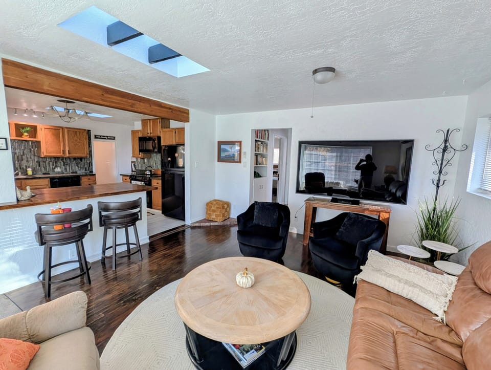 75" tv, leather couch w/recliners , swivel chairs, window bench seat & lazy boy 