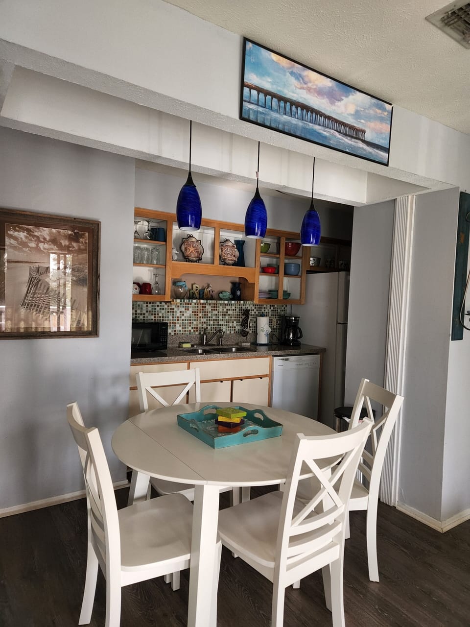 Darling exposed cabinetry offers character.