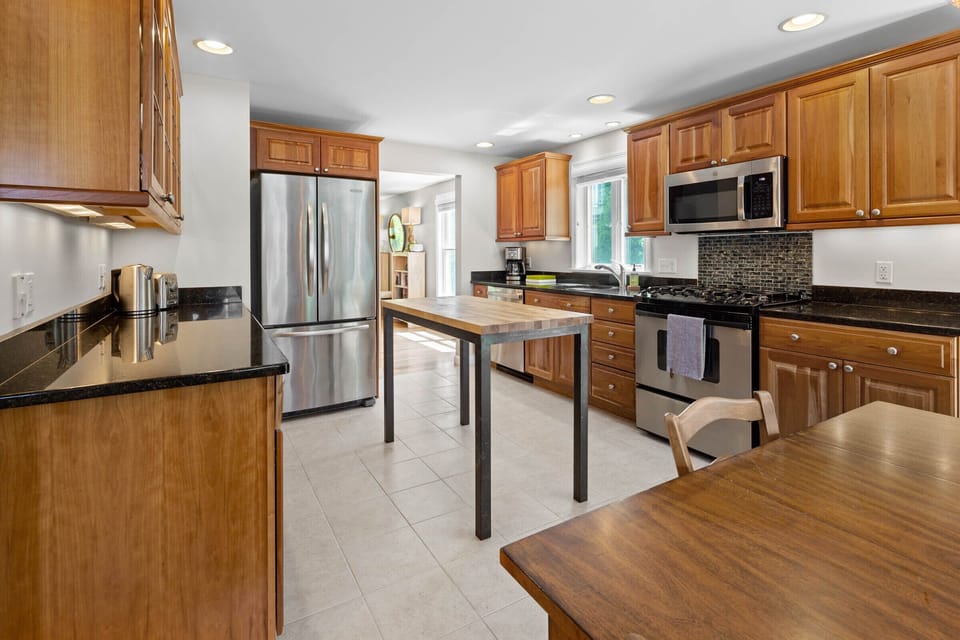 Kitchen (1st floor). Coffee maker, toaster, microwave, and dishwasher. 