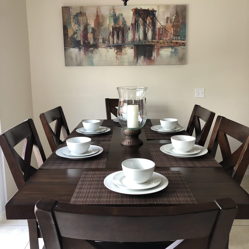 Dining Area with seating for 6 at table and 2 stools for counter seating