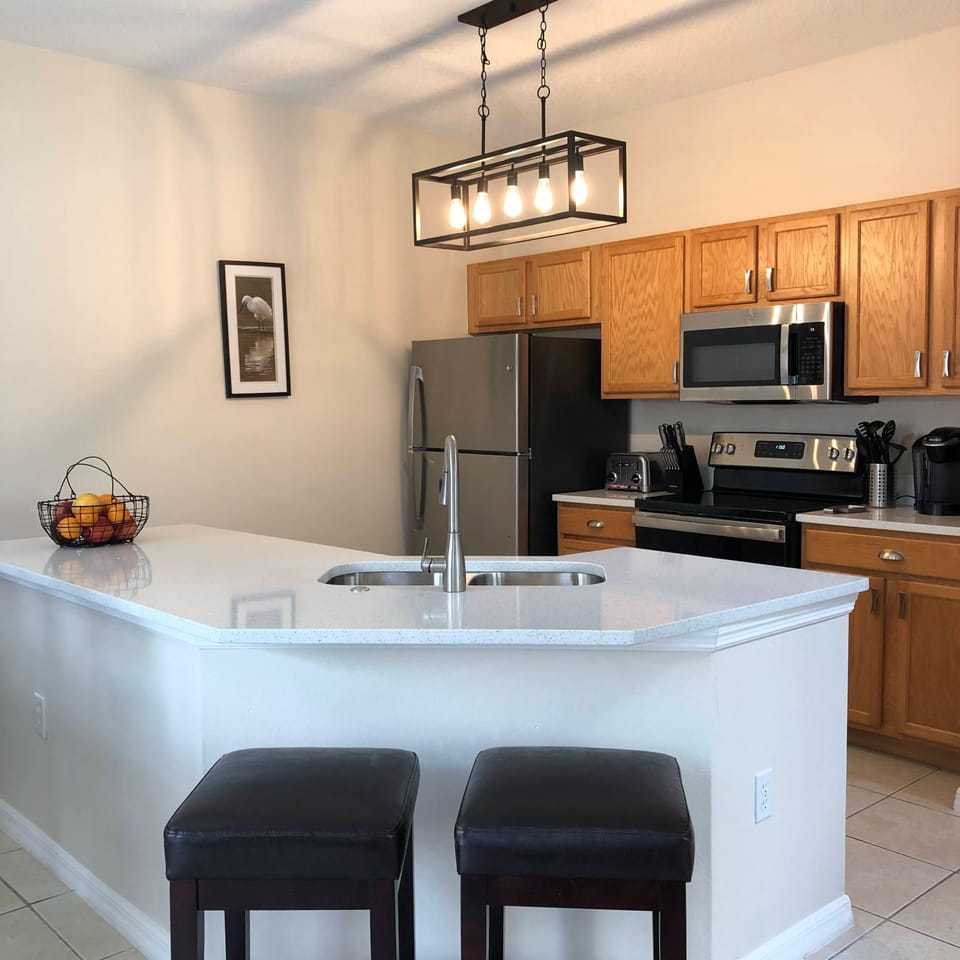 Renovated kitchen w/Quartz Countertops, Dishwasher, & Stainless Steel appliances