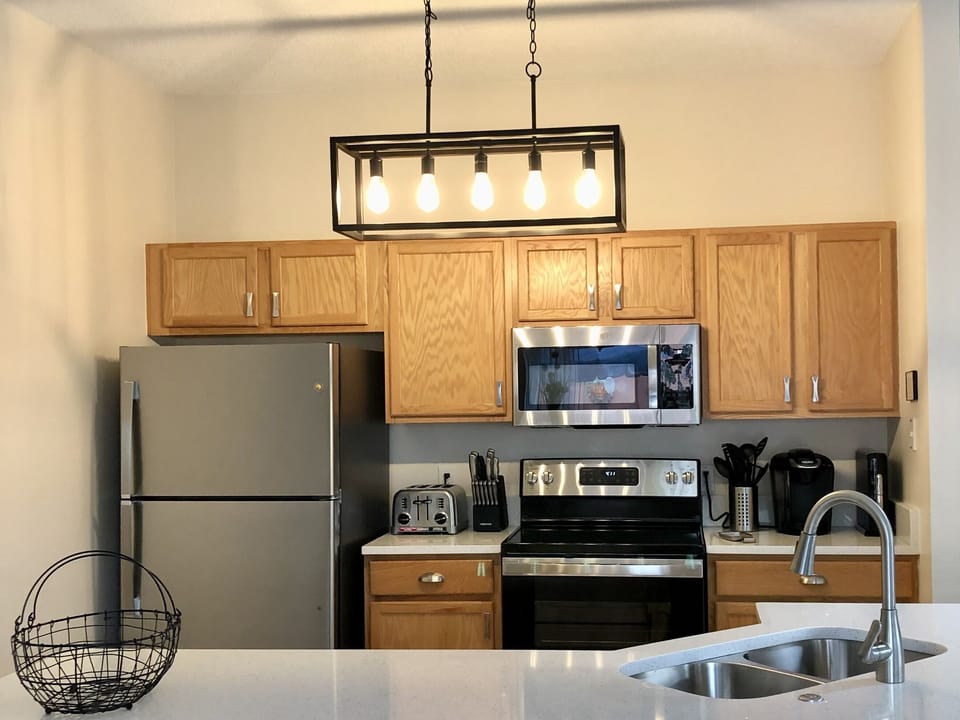 Renovated kitchen w/Quartz Countertops, Dishwasher, & Stainless Steel appliances