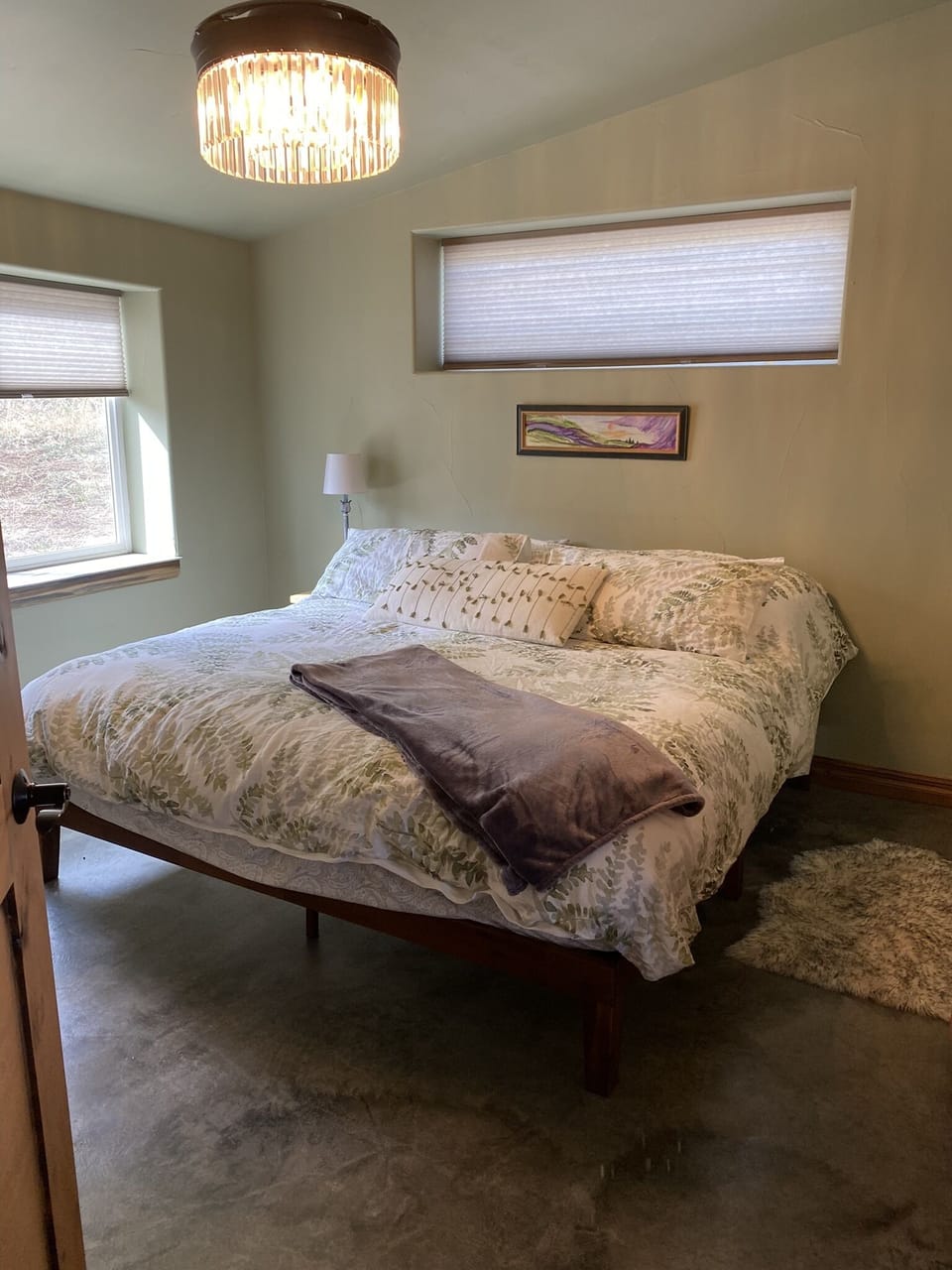 Bright master bedroom suite. Watch deer walk by while laying in bed!