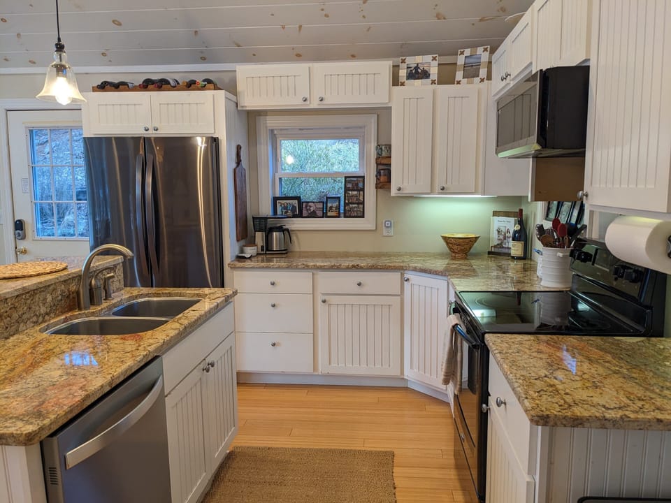 An open & functional kitchen with new appliances.