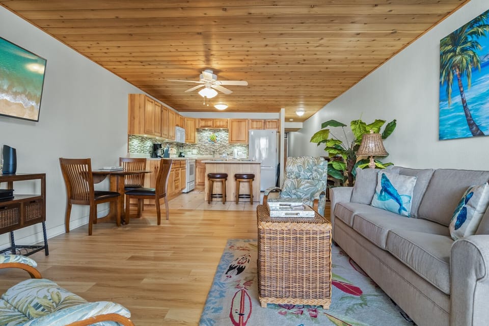 Spacious living area with tropical decor!