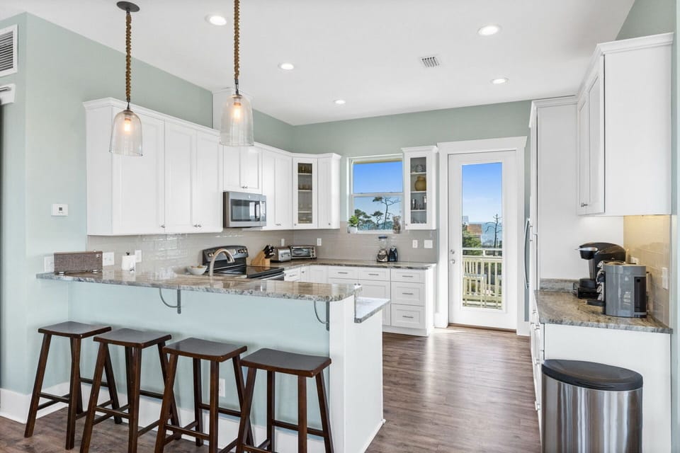 Kitchen - There is a back deck off of the kitchen facing the pond and gorgeous views of the bay.