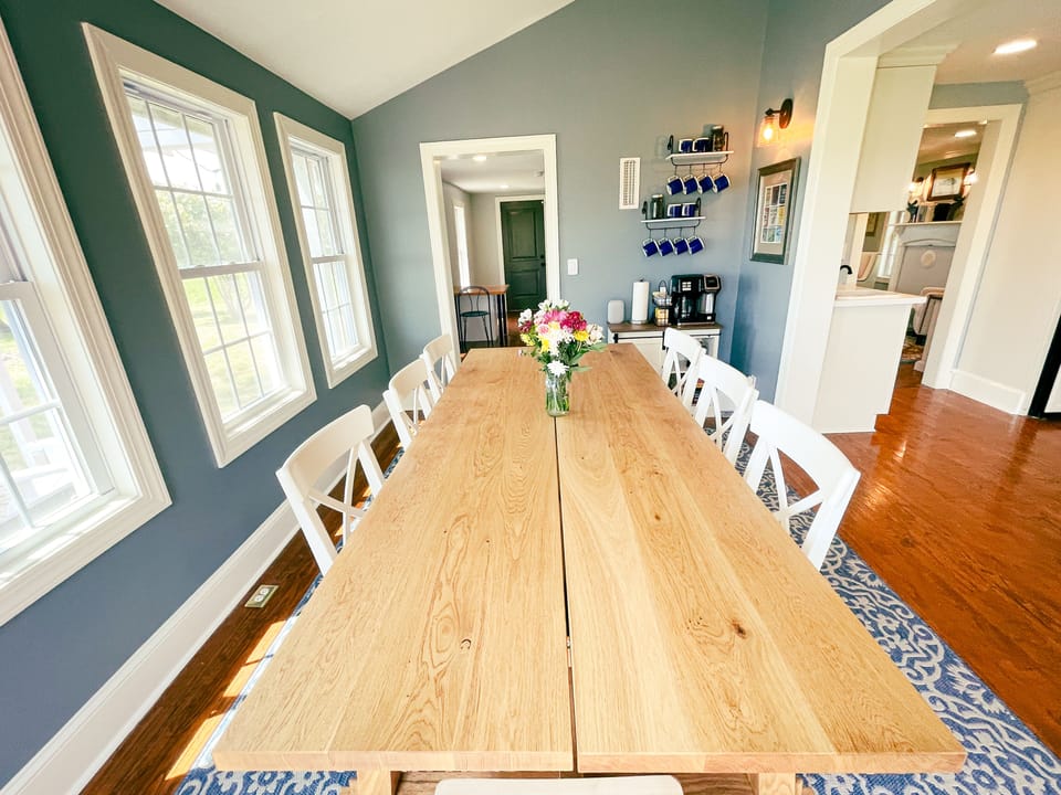 Dining room comfortably seats eight and opens directly to the kitchen.