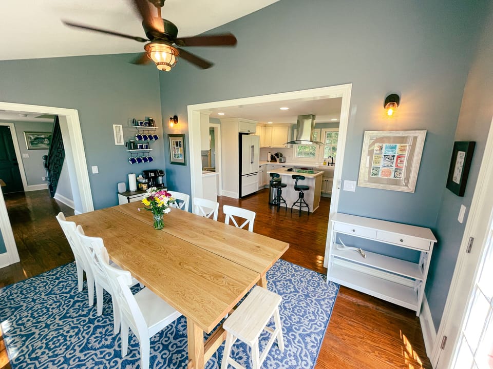 Our dining room comfortably seats eight and opens directly to the kitchen.