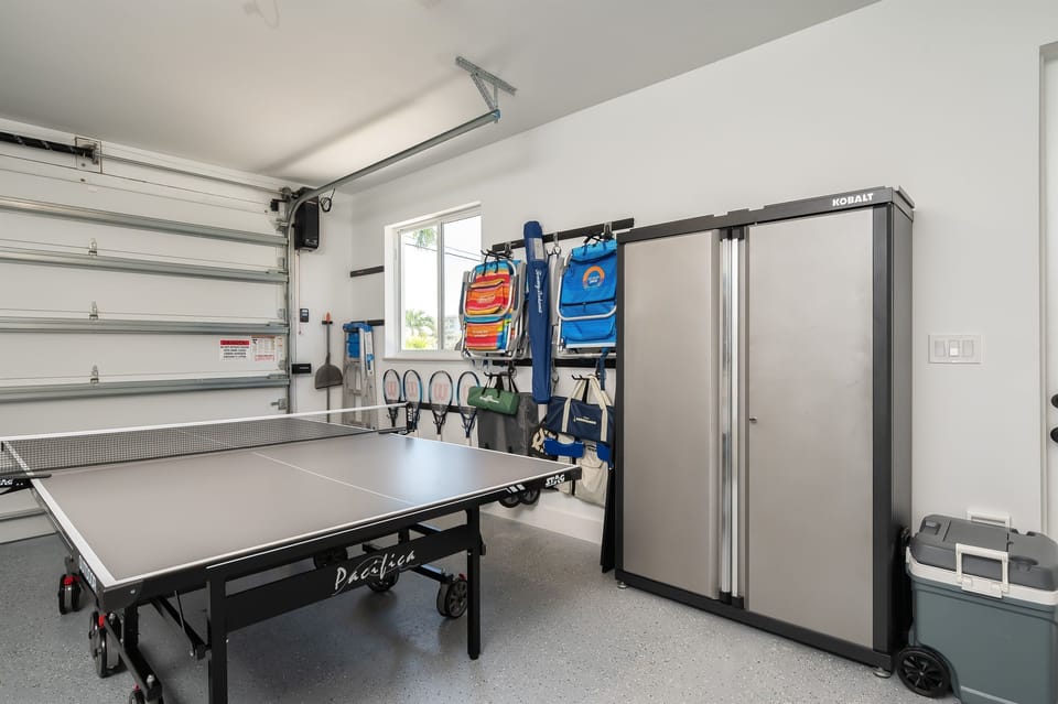 Beach chairs, racquets, games, and cooler for use