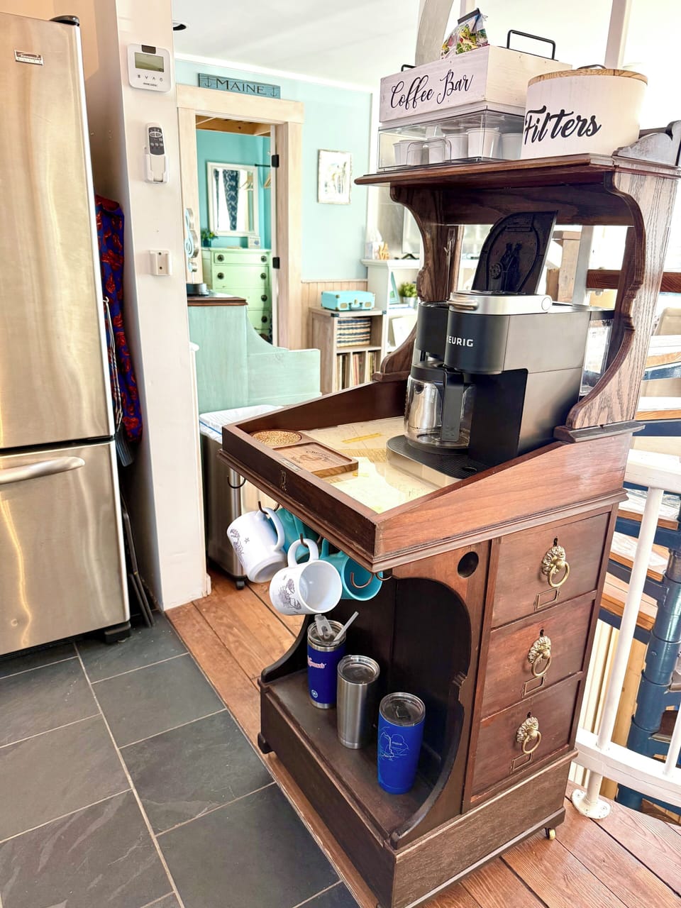 The kitchen has a custom built coffee cart made from an antique captain's desk