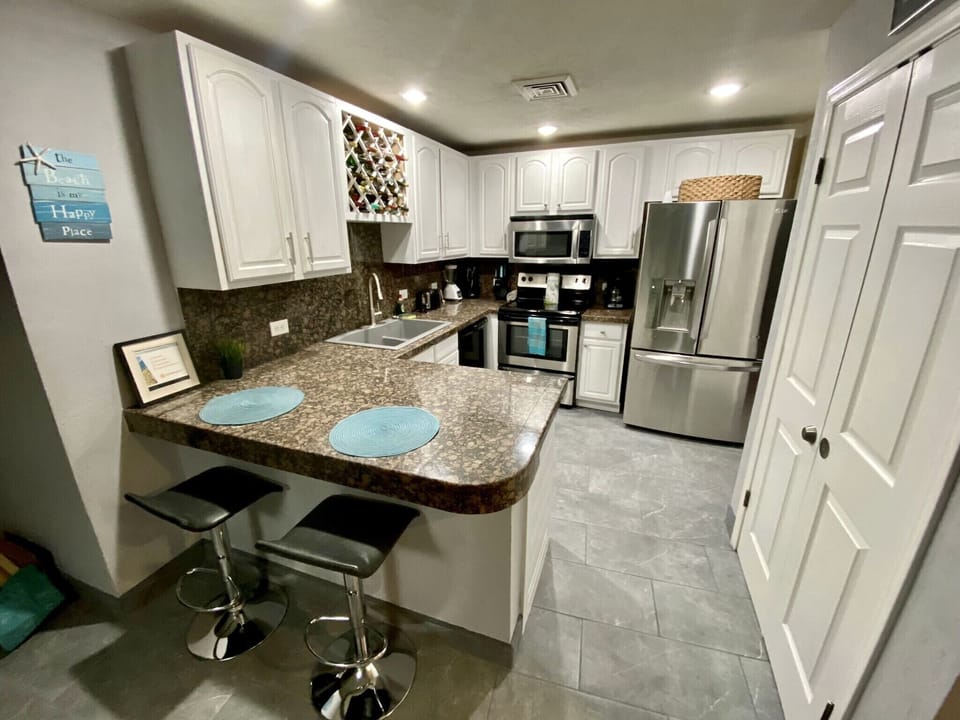 Full kitchen with upgraded stain steel appliance package. New sink and faucet
