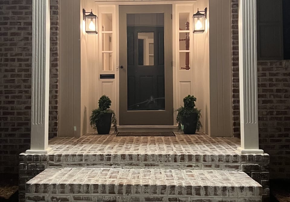 Front door entry with motion sensor lights.