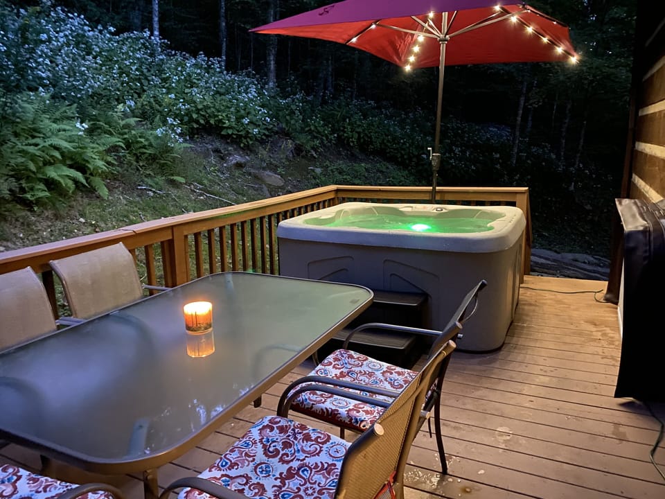 Relax in the hot tub on the private back deck.