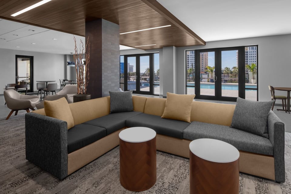 Unwind on plush seating with breezy poolside views.