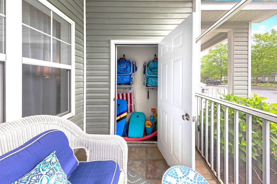 The patio closet holds all of the beach chairs and beach toys for you!