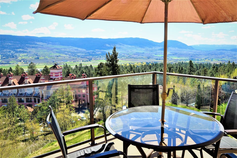 Sunny deck features seating for 4 and views of the golf course and greenspace