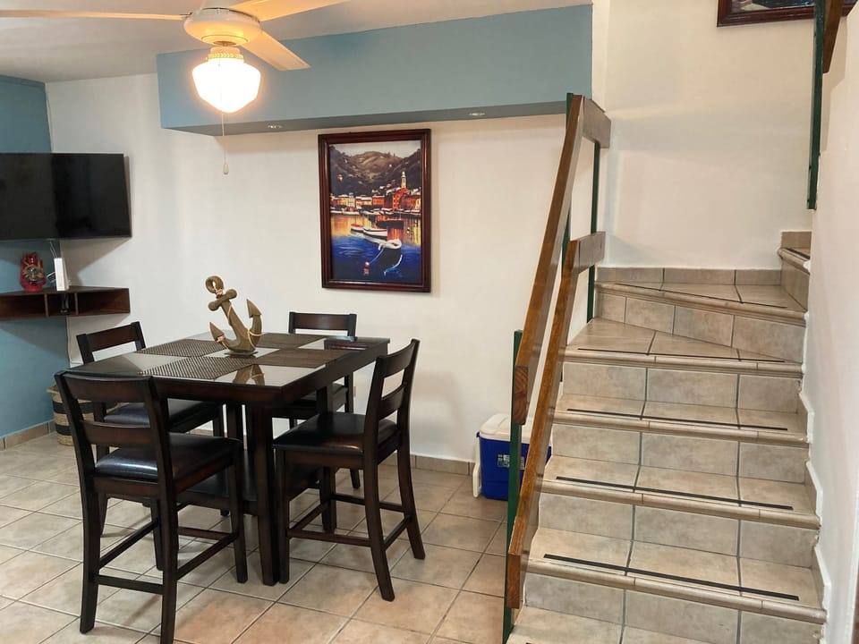 Dining room with TV and ceiling fan