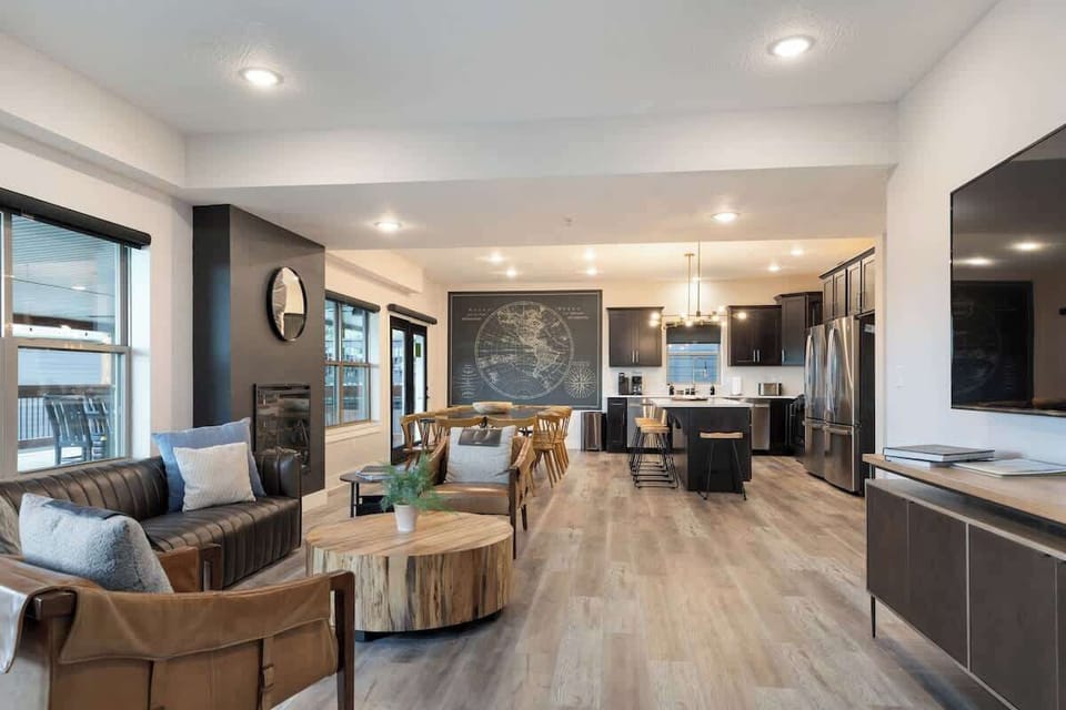 Spacious, open main living room, kitchen, dining room, and access to the huge deck!
