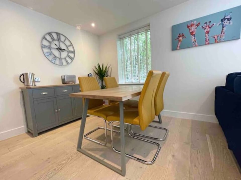 The dining area with sideboard containing the kettle, coffee machine and toaster