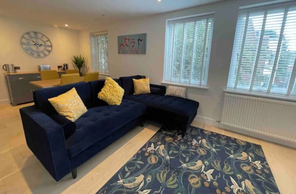 A view of the sitting room with the dining area behind.