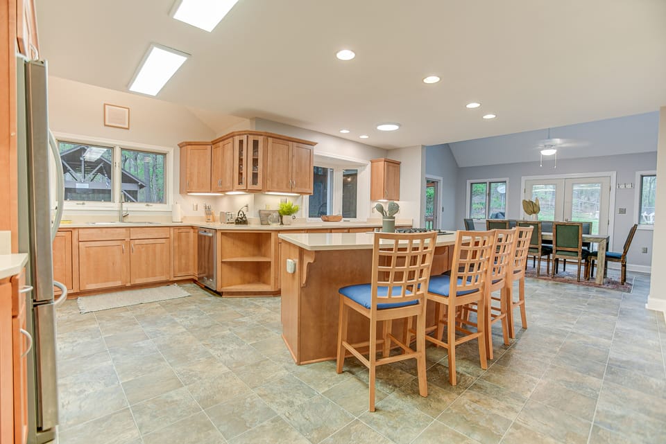 Large and spacious kitchen with comfy barstool seating.