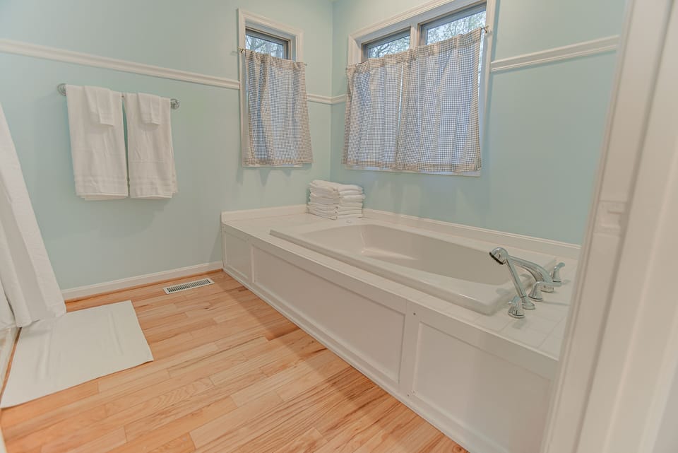 Full Bath 1 located on the main level with jacuzzi tub and shower.