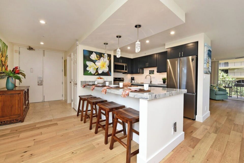 The heart of the home! Open, airy, and ready for your morning coffee rituals. Grab a stool and let the vacation vibes sink in.