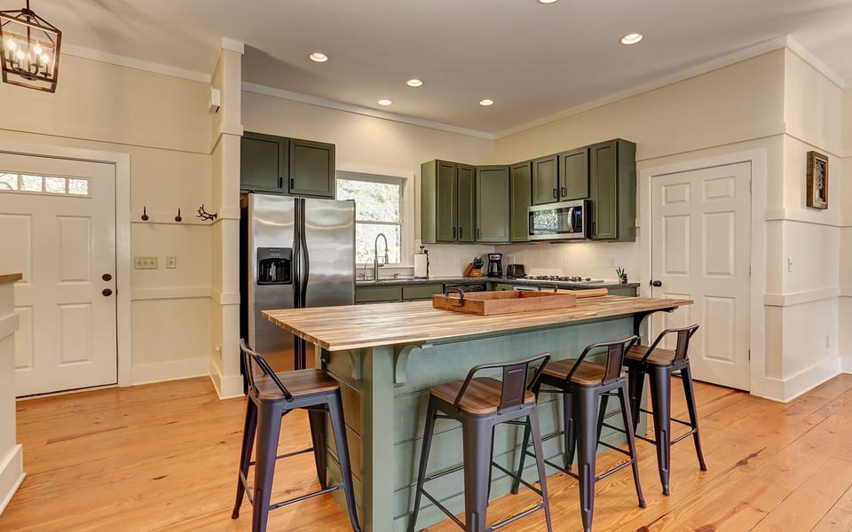 Stylish cabin kitchen with island seating.