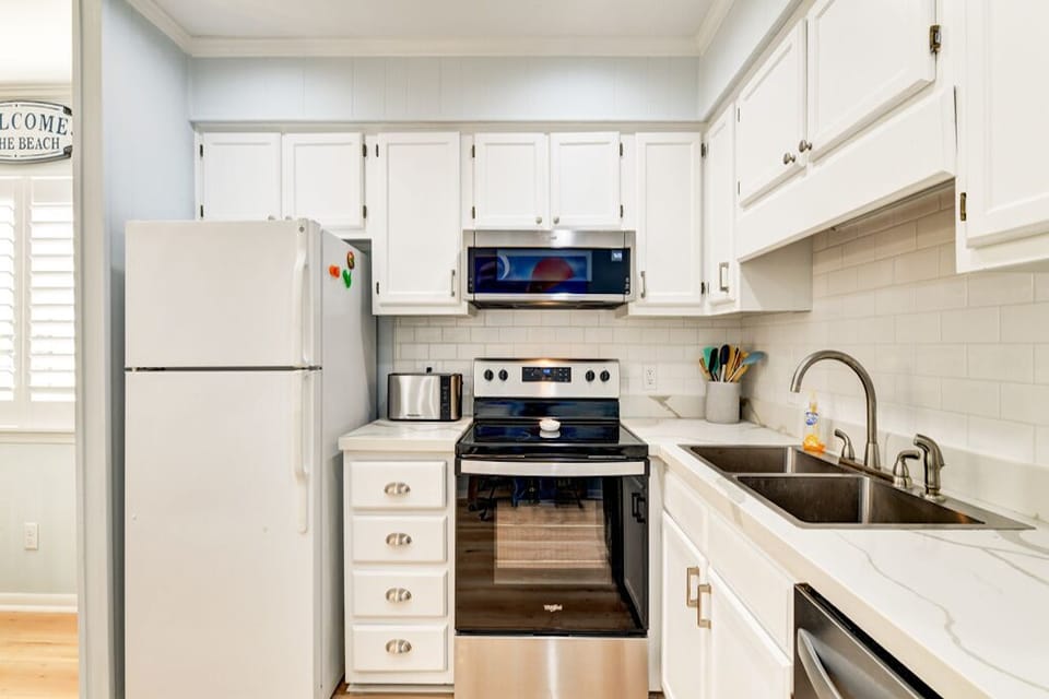 Toaster, blender, mixing bowls, pots/pans & everything you need to make meals.