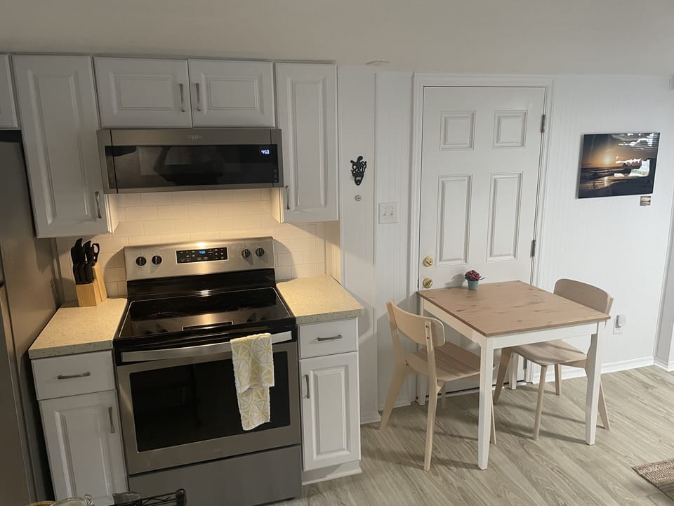 Full kitchen with dining table. 