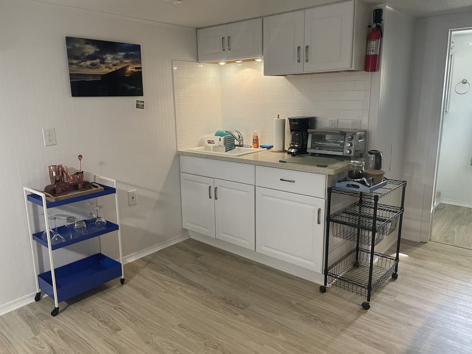 Wet bar with bar cart. 