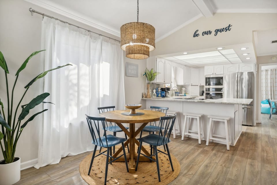 Gather around the charming dining area, where modern design meets comfort