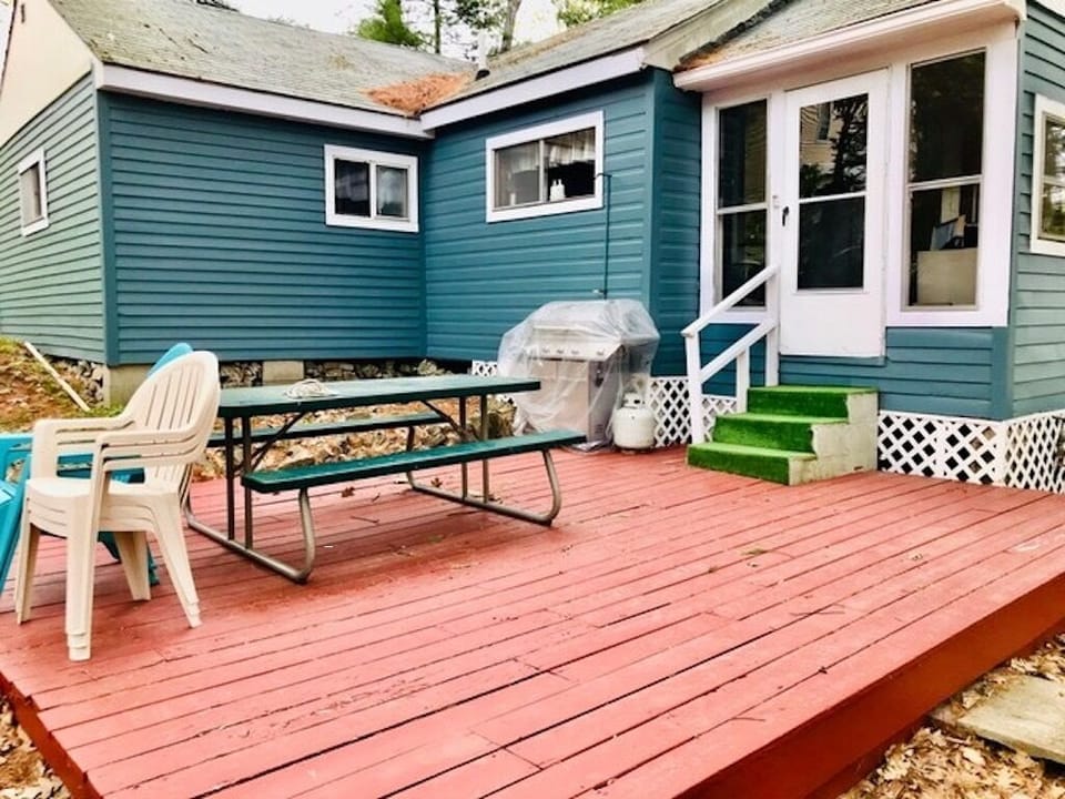 Sunny patio with BBQ grill.