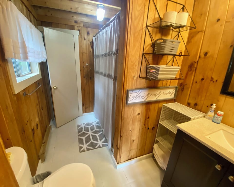 Bathroom with full tub and shower.