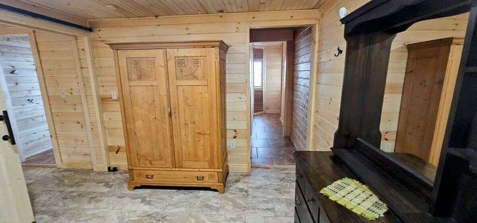 I love what they did with those mirrors down the that hall. Its so nice having some natural light in here. 