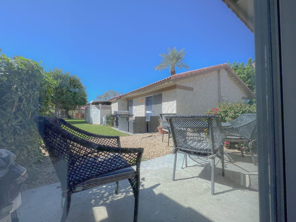 view of patio with chairs and table