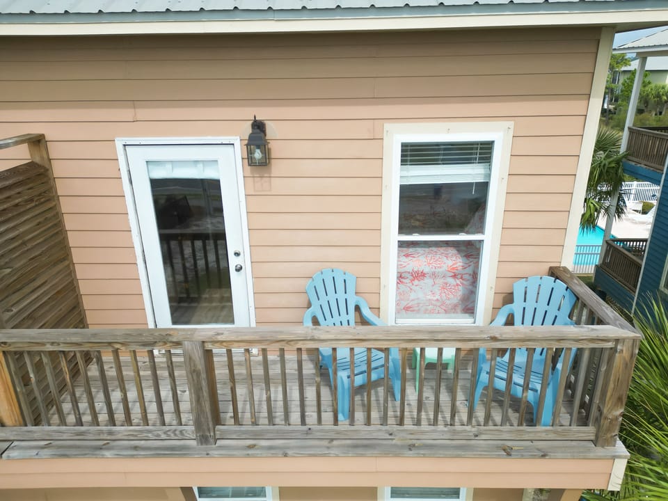 Balcony from twin bedroom. Views of neighborhood and obstructed views to ocean